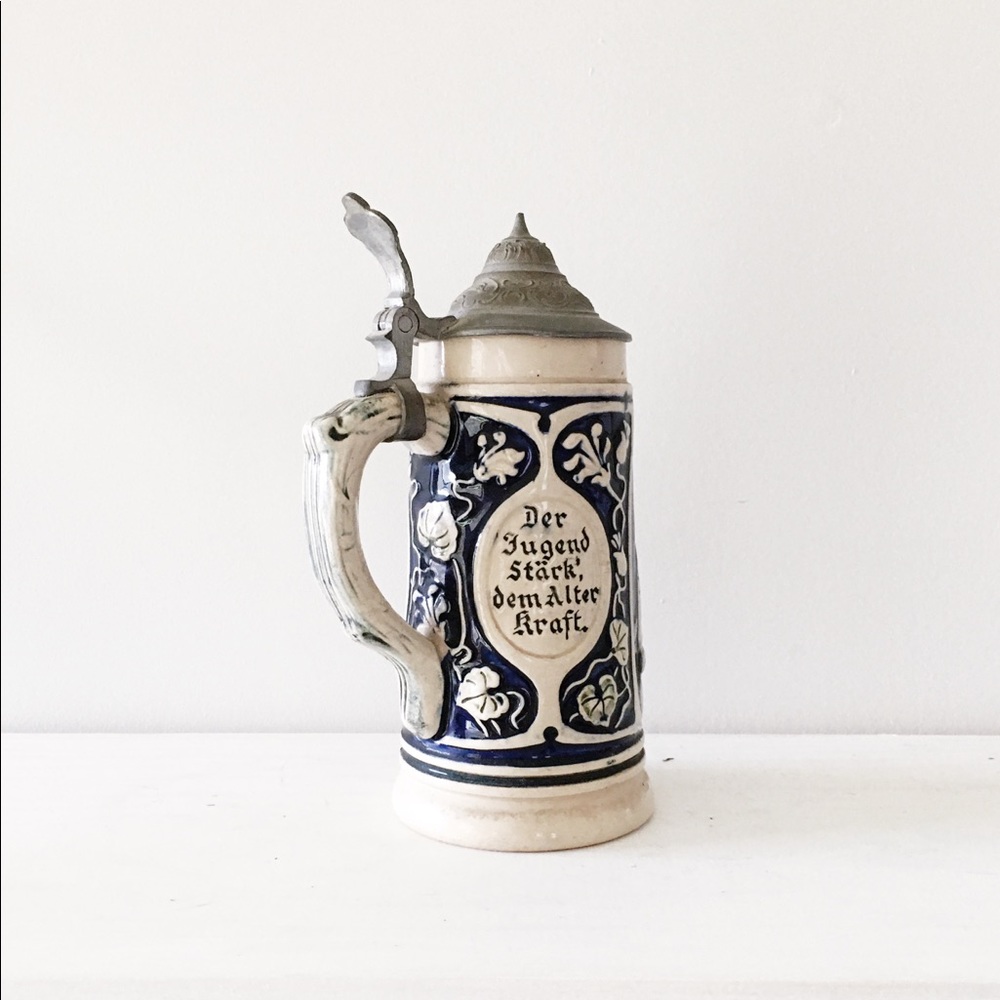German stoneware beer stein with pewter lid